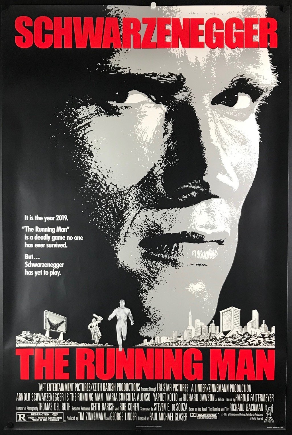 An original movie poster for the film The Running Man