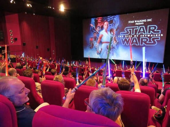 Members of the Star Walking Star Wars fan club attending a midnight screening of The Rise of Skywalker