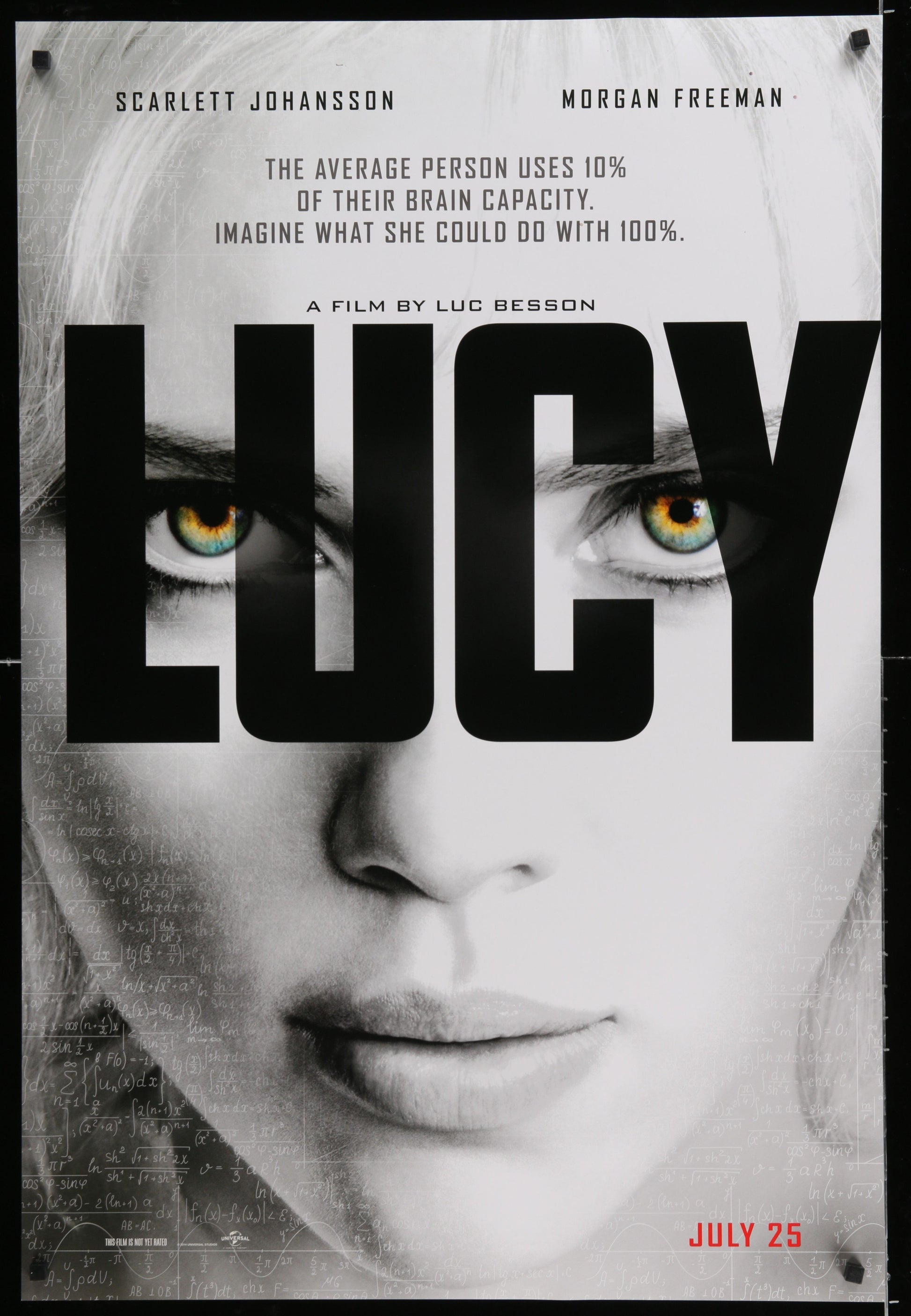 An original movie poster for the Luc Besson film Lucy